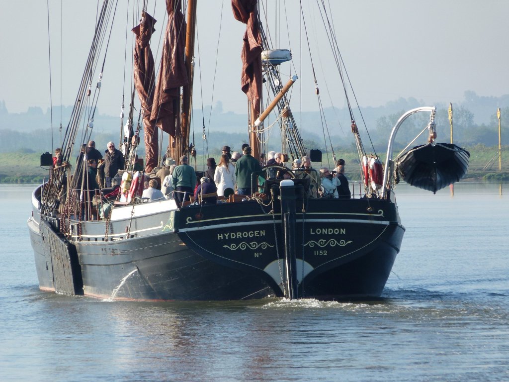 Barge Hydrogen heading down river from Maldon Quay